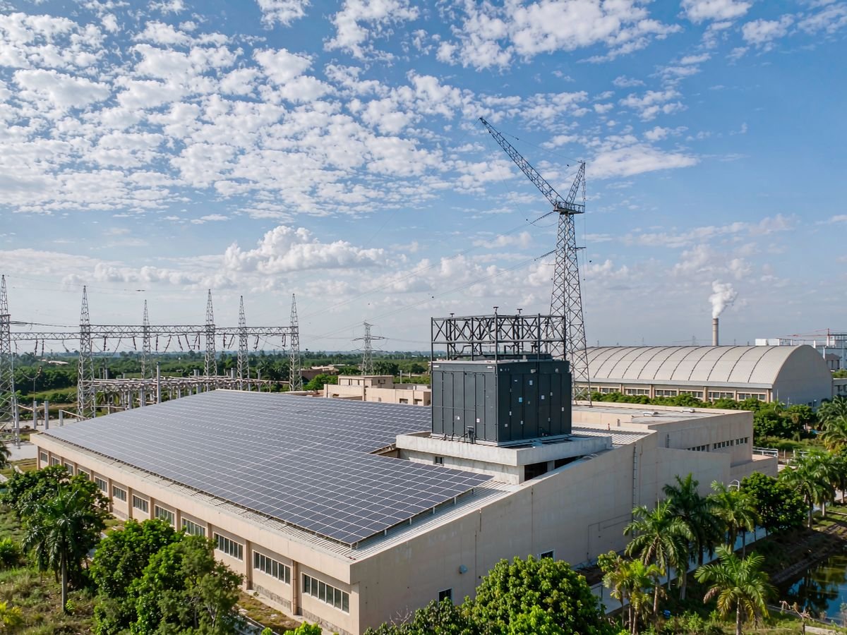 Industrial plant in Nigeria with solar array and battery storage container