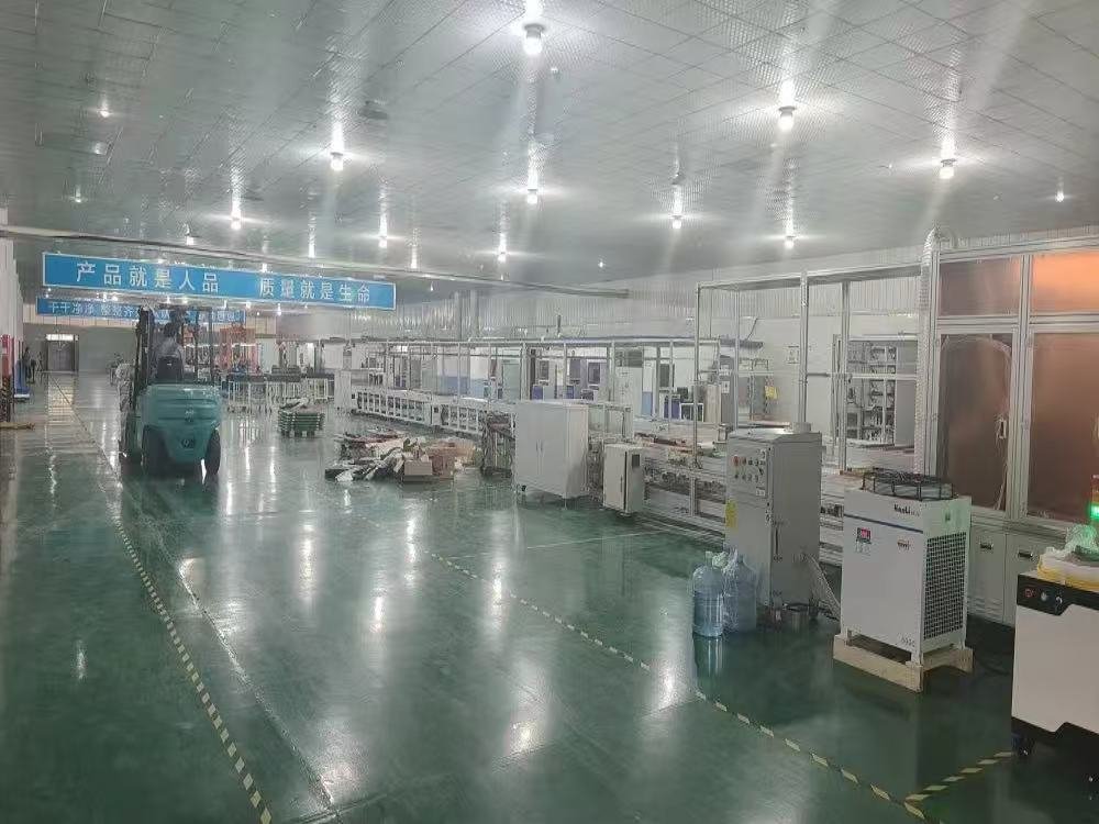 Buyer inspecting solar panel production lines during a factory audit in China