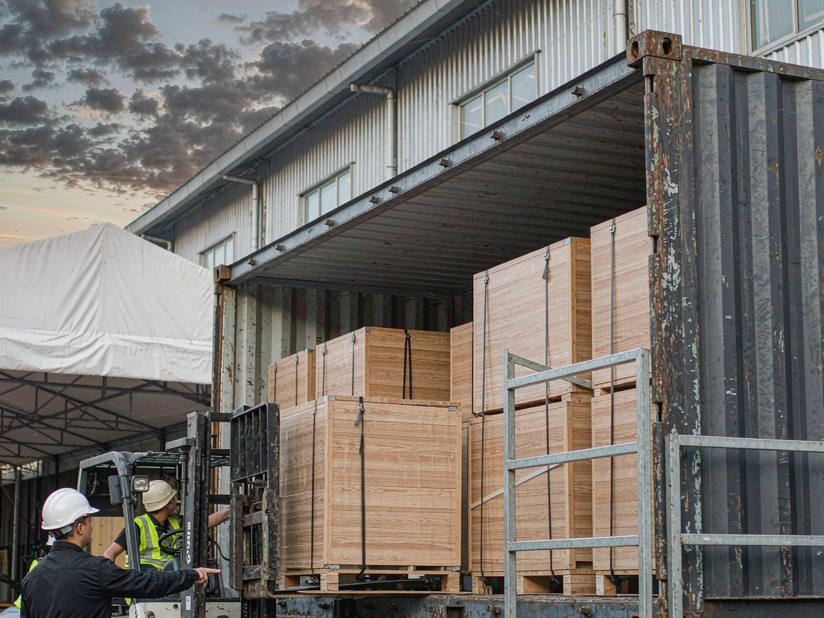 Export-packed solar panels and battery cabinets being loaded into a 20ft container for sea freight from China to Tema, Ghana