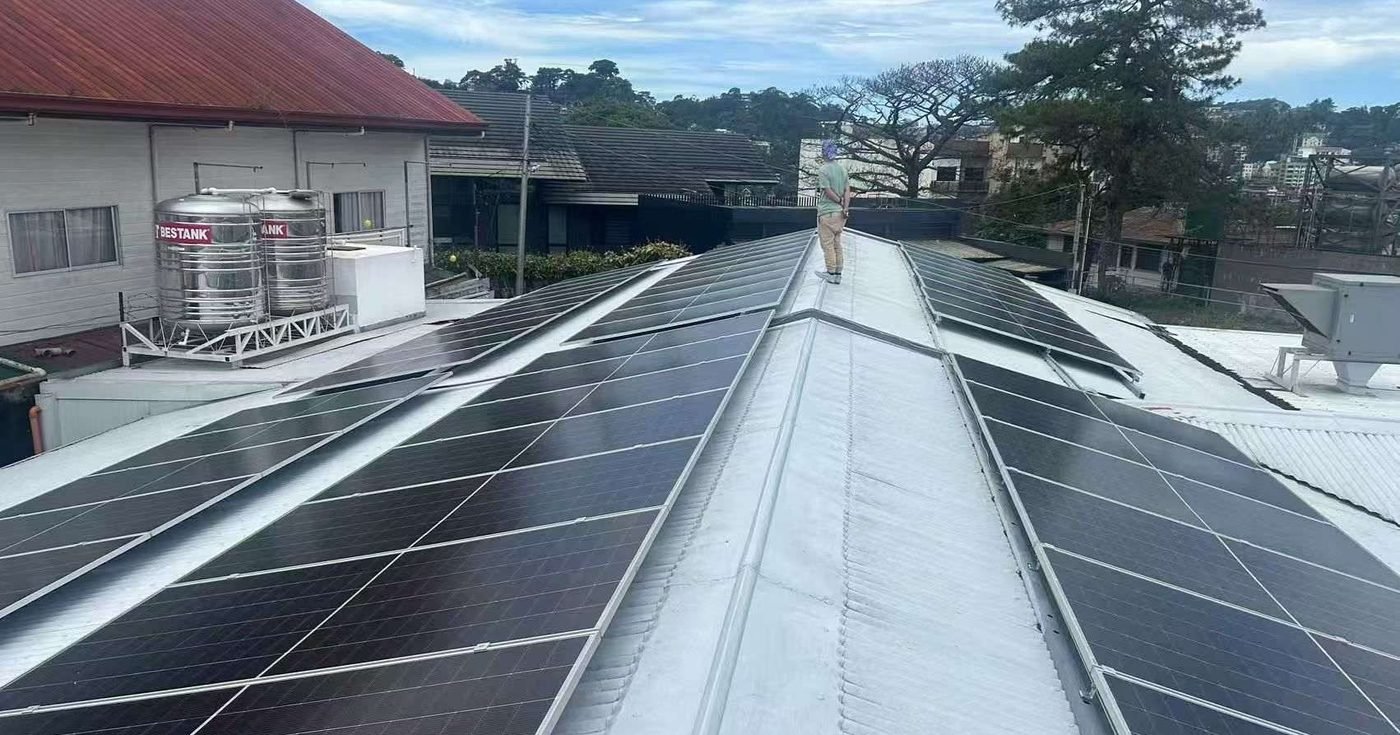 Commercial rooftop solar array on a tropical building — a typical Ghanaian commercial solar installation