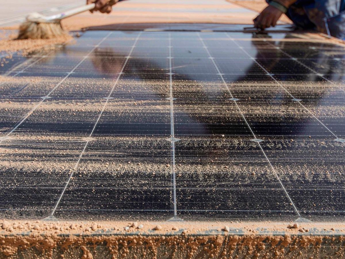 Dust accumulation on solar panels in Middle East heat conditions, photographed before a scheduled cleaning cycle