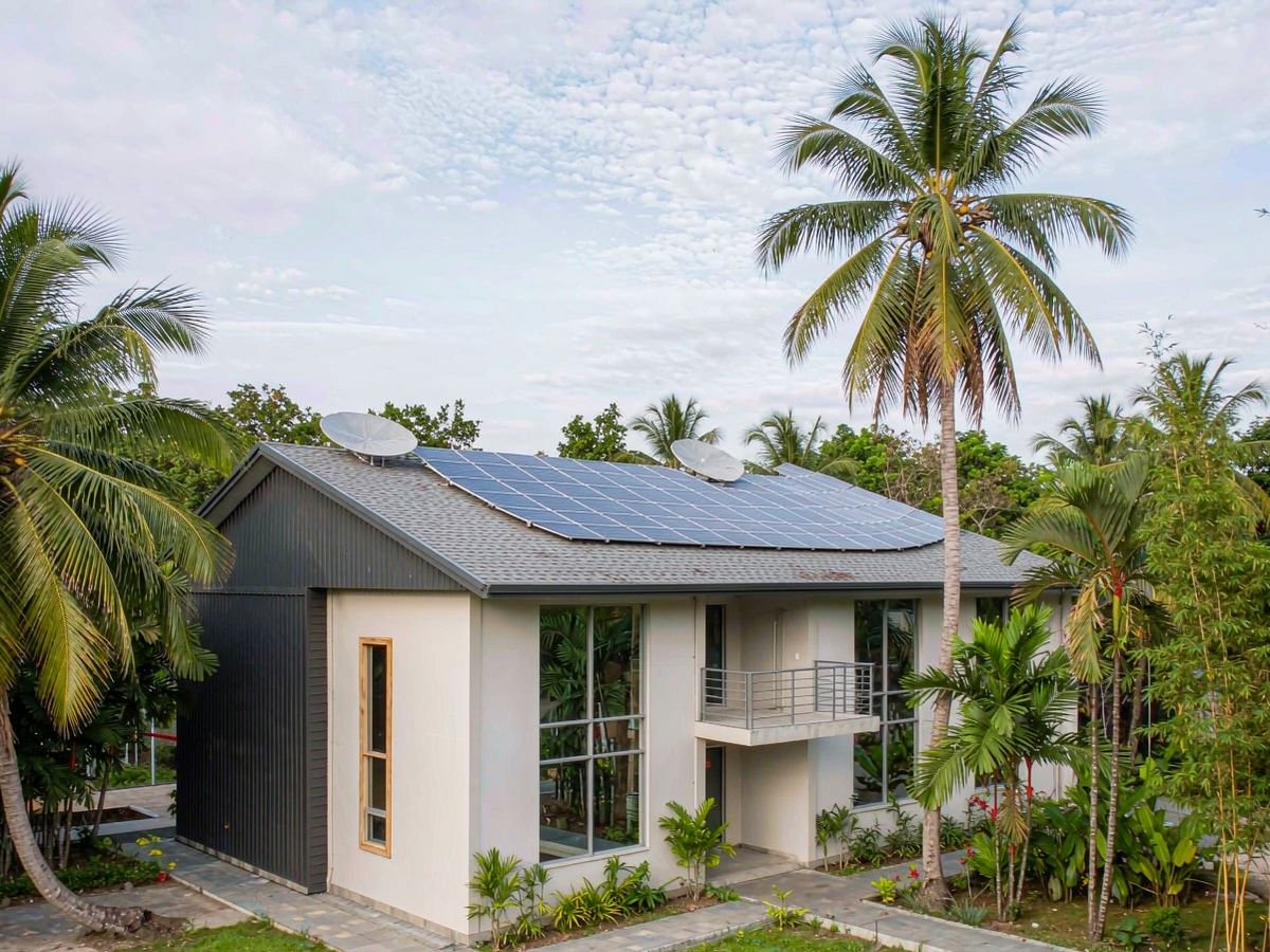 Tropical Philippine commercial building with a rooftop solar array