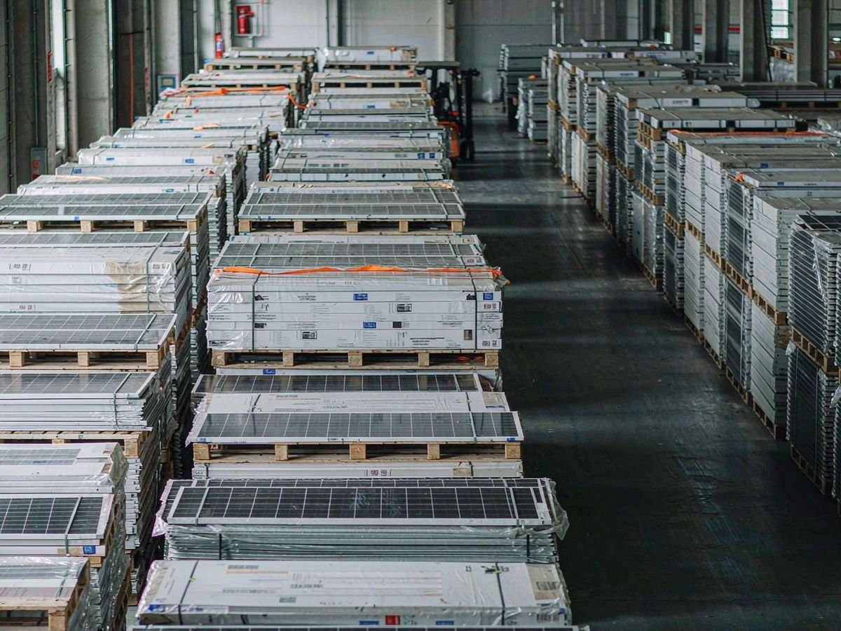 Warehouse with palletized solar panels ready for export