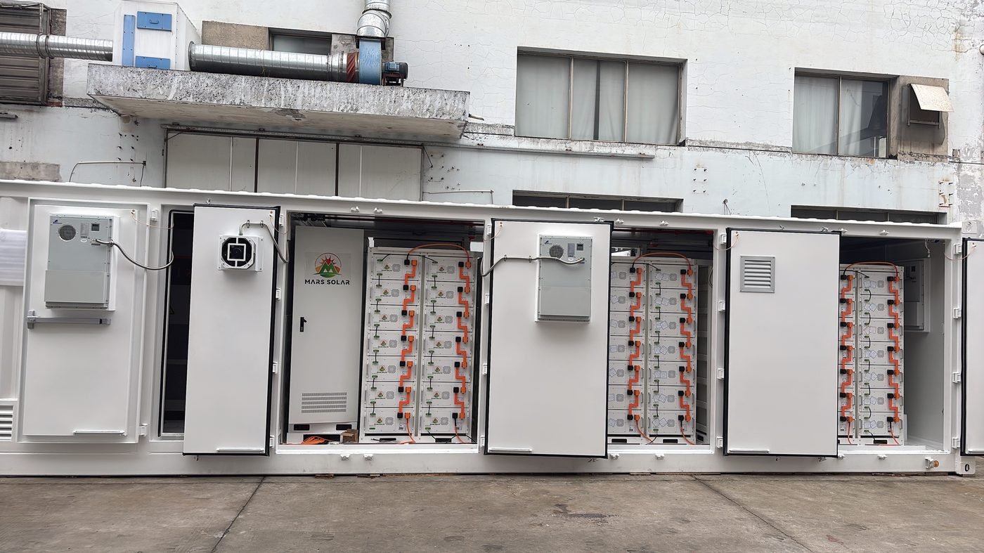 Row of battery containers forming the 6MW solar storage system