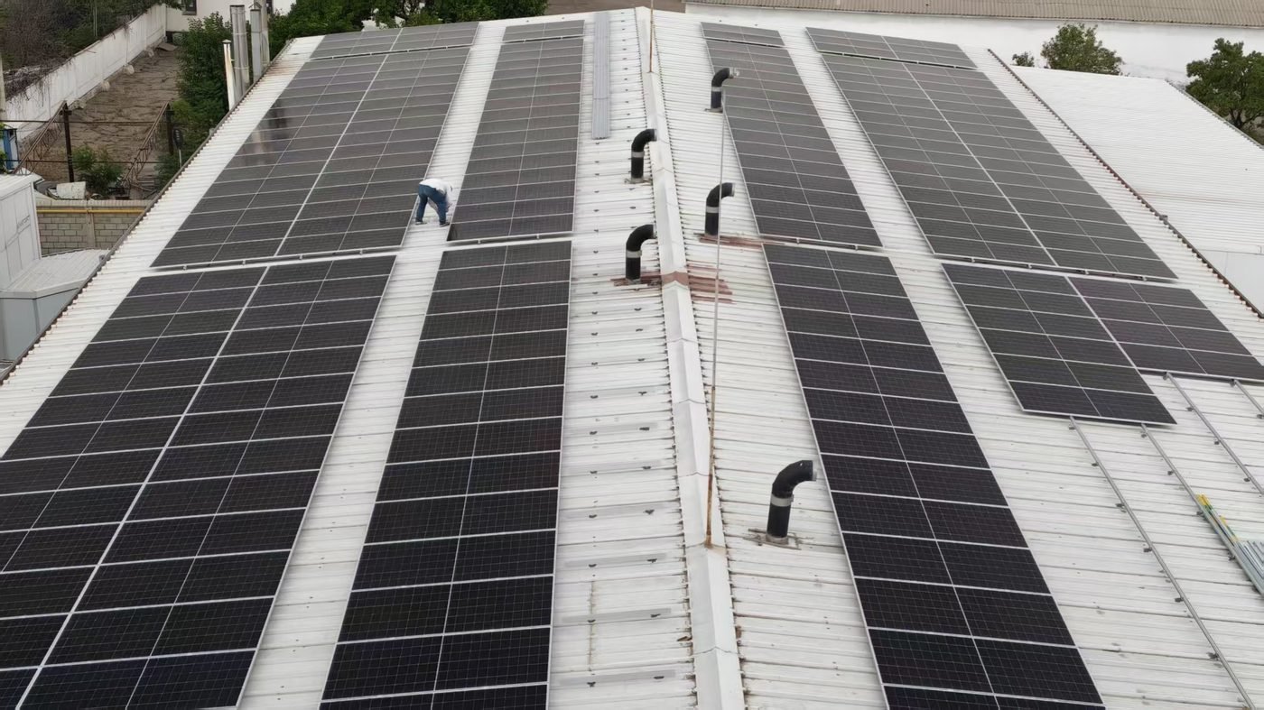 Module rows of the rooftop solar system for factory, aerial view