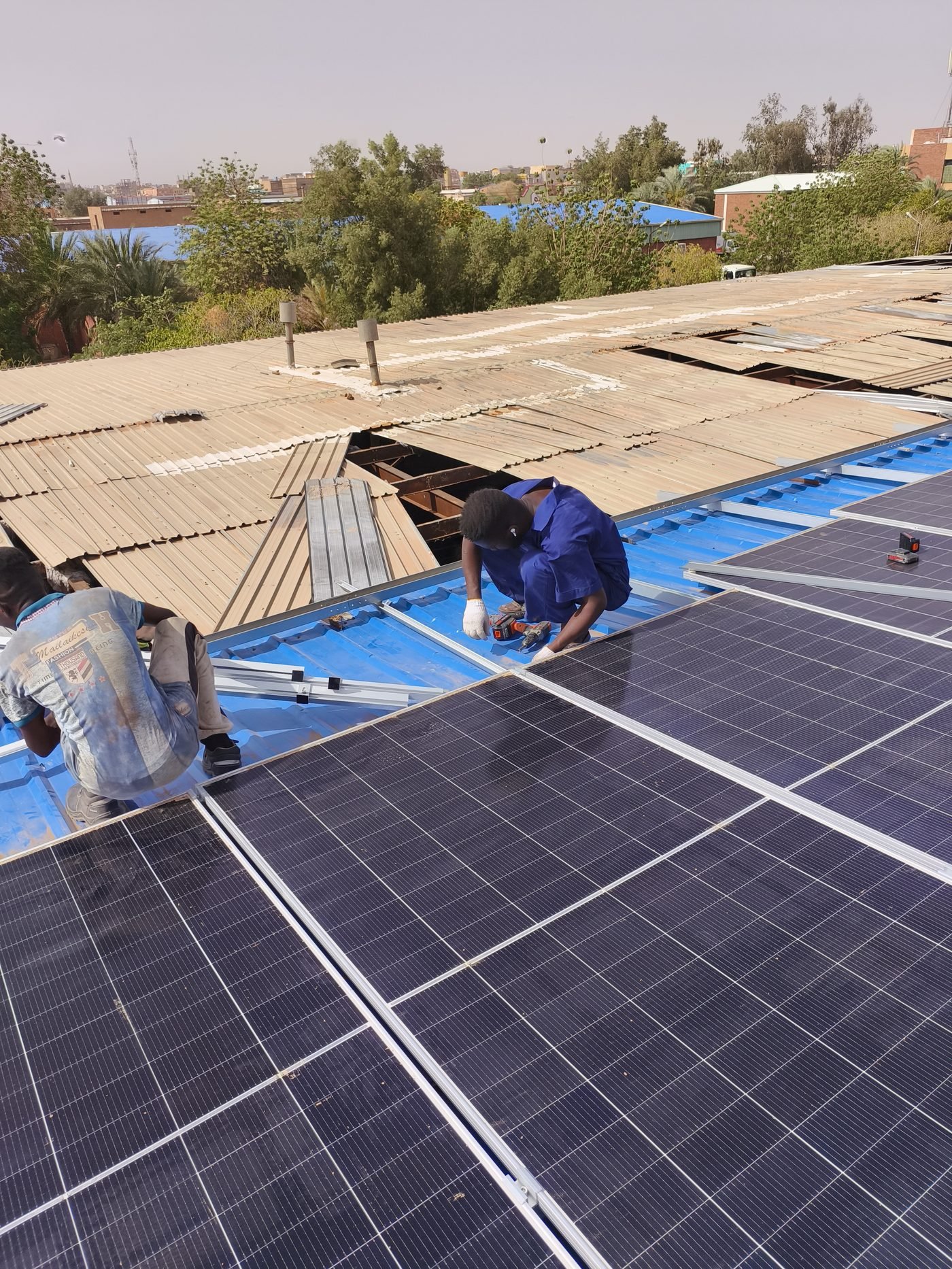 Engineers installing the rooftop solar system for wastewater plant in Sudan